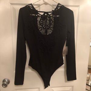 NWT! Body suit with Lace details and open back